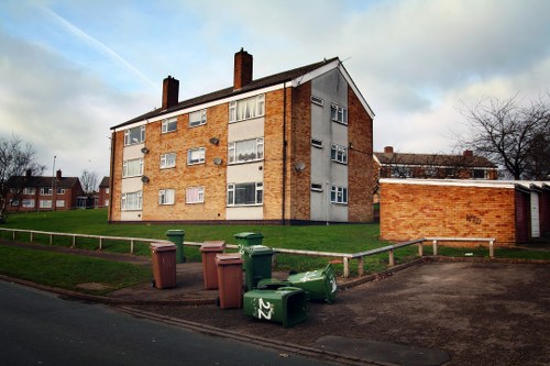 Builders placing a skip on-site in Uxbridge